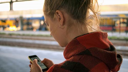 woman holding phone